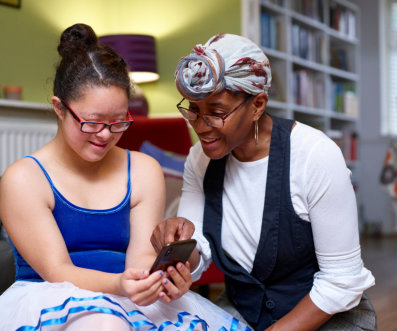 woman and child looking at a phone