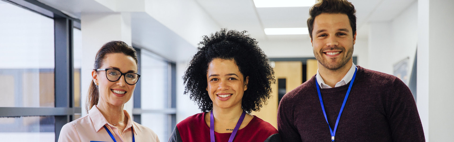 three staff smiling