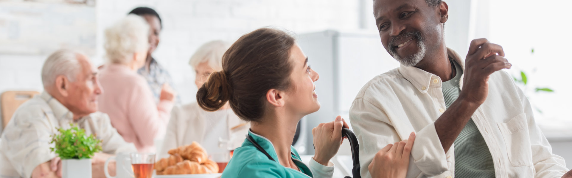 nurse talking to an elderly man