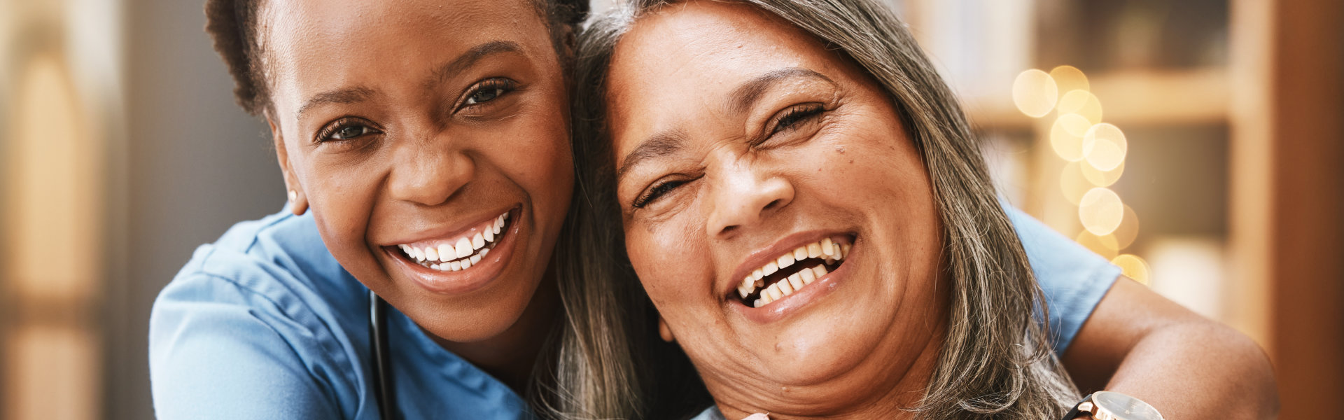 elderly woman and nurse smiling