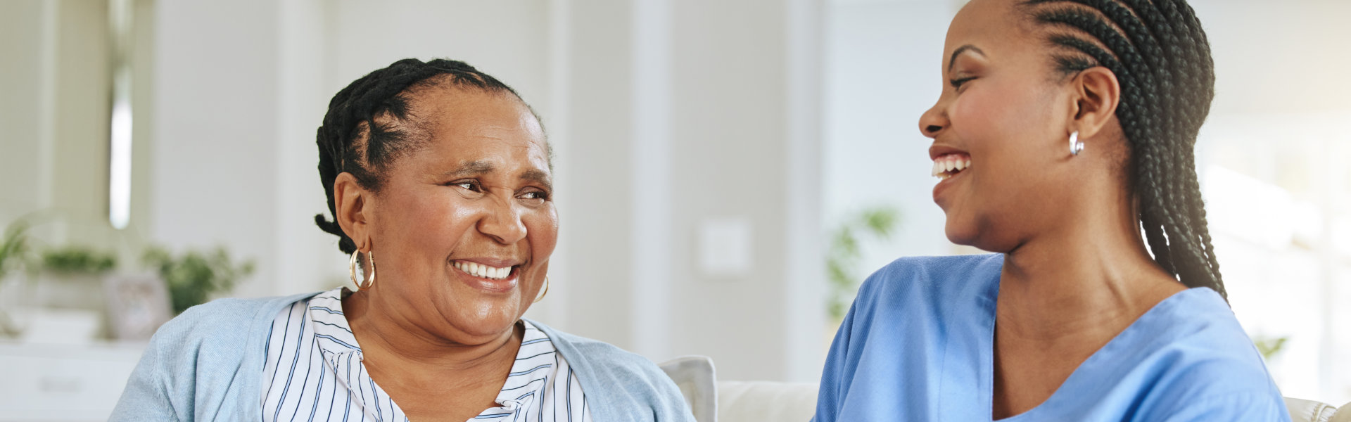 elderly and nurse smiling