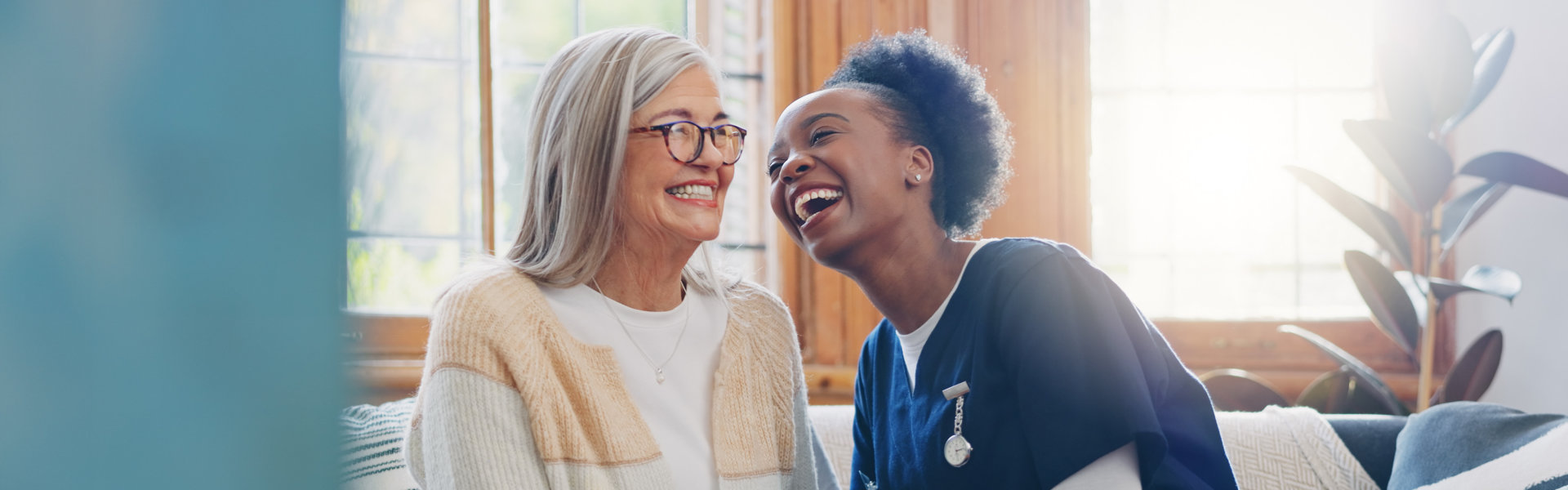 elderly and nurse laughing